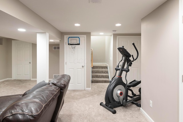 workout area with baseboards, visible vents, and carpet
