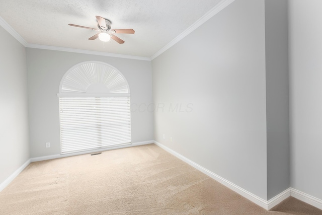 unfurnished room featuring carpet flooring, baseboards, and ceiling fan