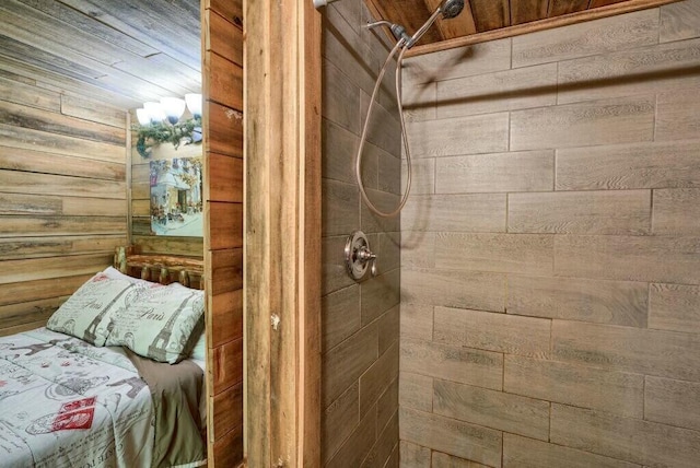 interior space with wooden walls and a tile shower
