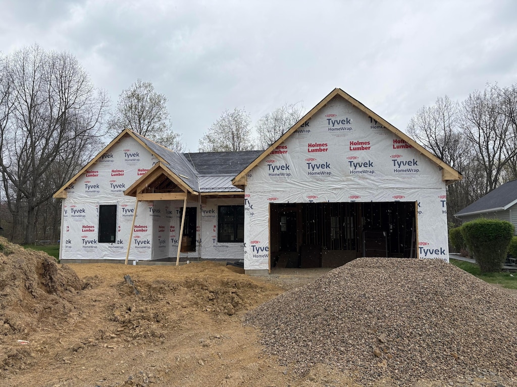 property under construction with metal roof