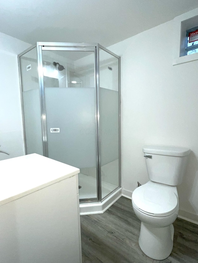 1616 Koebel Rd, Columbus, OH 43207 - full bath featuring a shower stall, toilet, baseboards, and wood finished floors