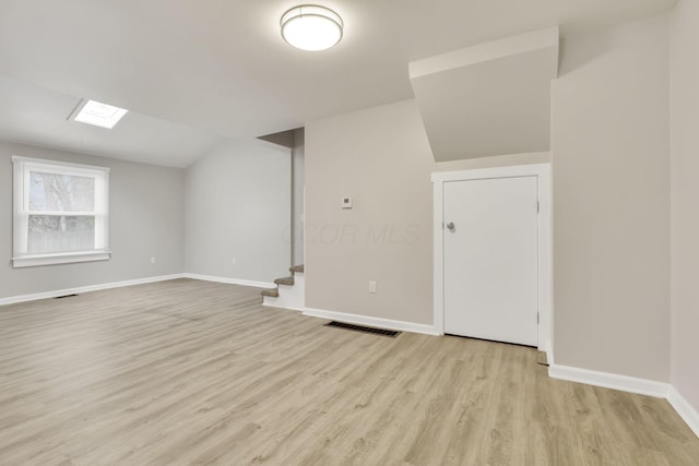 681 Stewart Ave, Columbus, OH 43206 - bonus room with visible vents, baseboards, light wood finished floors, vaulted ceiling, and stairs
