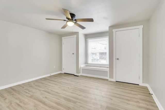 681 Stewart Ave, Columbus, OH 43206 - spare room featuring light wood finished floors, baseboards, and a ceiling fan