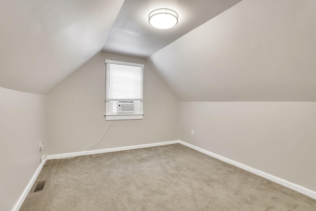 681 Stewart Ave, Columbus, OH 43206 - additional living space with visible vents, baseboards, carpet flooring, and cooling unit