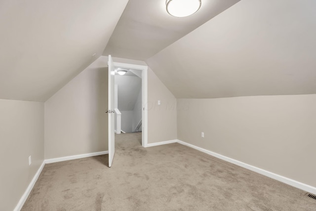 681 Stewart Ave, Columbus, OH 43206 - bonus room featuring visible vents, carpet floors, baseboards, and vaulted ceiling