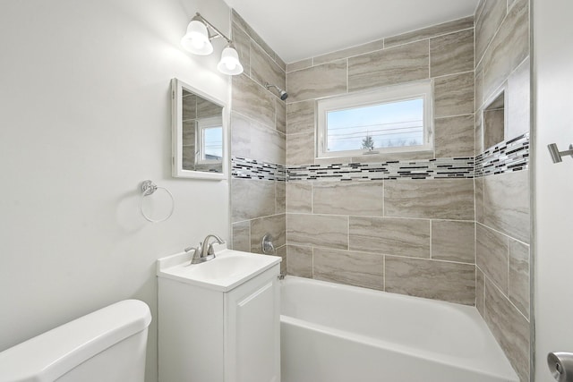 full bath featuring bathing tub / shower combination, toilet, and vanity