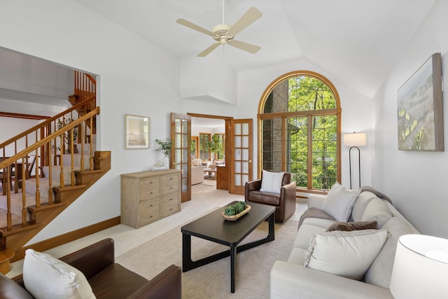 1299 Stratford Woods Dr, Newark, OH 43055 - living area with vaulted ceiling, a ceiling fan, stairway, light carpet, and baseboards