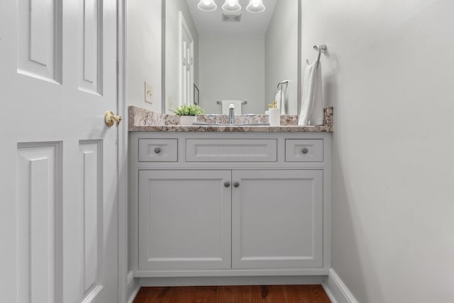 1299 Stratford Woods Dr, Newark, OH 43055 - bathroom featuring vanity, wood finished floors, and baseboards