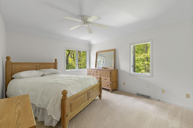 1299 Stratford Woods Dr, Newark, OH 43055 - bedroom featuring multiple windows, light colored carpet, baseboards, and ceiling fan