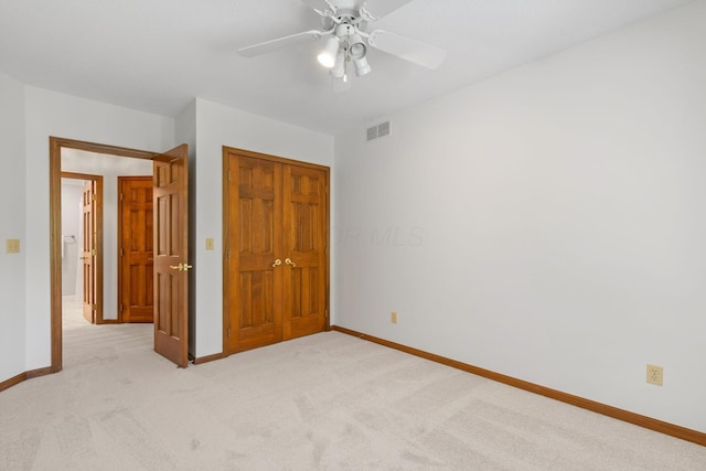 1299 Stratford Woods Dr, Newark, OH 43055 - unfurnished bedroom featuring light carpet, baseboards, a closet, and a ceiling fan