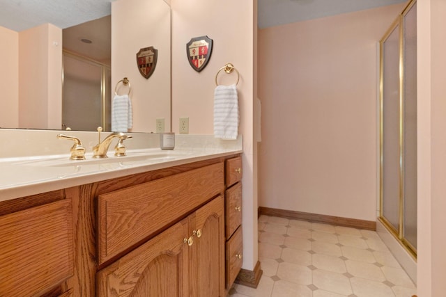 1299 Stratford Woods Dr, Newark, OH 43055 - bathroom featuring a shower stall, vanity, baseboards, and tile patterned floors