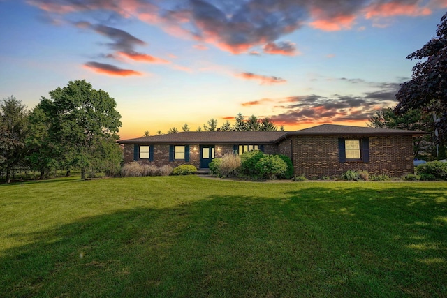 7704 Old Tarlton Pike, Circleville, OH 43113 - ranch-style home featuring brick siding and a yard