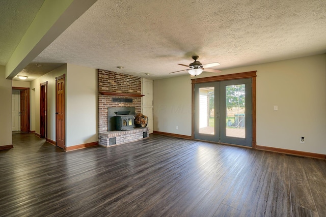7704 Old Tarlton Pike, Circleville, OH 43113 - unfurnished living room featuring ceiling fan, baseboards, dark wood finished floors, a textured ceiling, and french doors