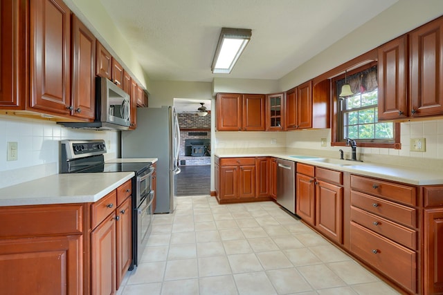 7704 Old Tarlton Pike, Circleville, OH 43113 - kitchen with stainless steel appliances, a sink, tasteful backsplash, and light countertops