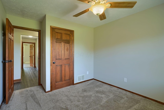 7704 Old Tarlton Pike, Circleville, OH 43113 - unfurnished bedroom featuring baseboards, carpet floors, ceiling fan, and a closet