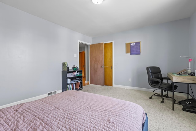bedroom with carpet, visible vents, and baseboards