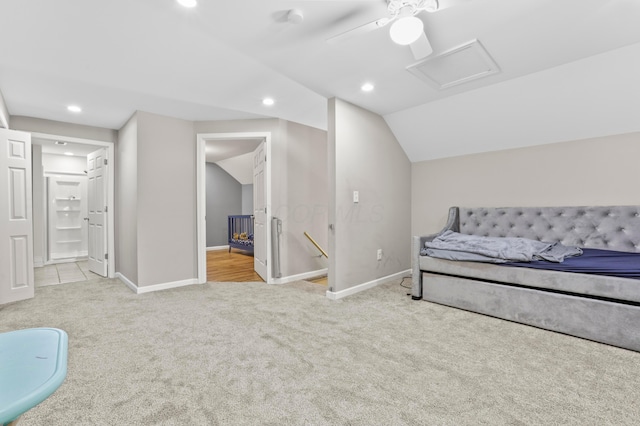 bedroom with baseboards, attic access, carpet, and lofted ceiling
