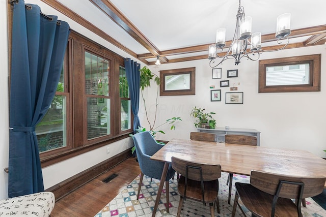 dining space with a notable chandelier, baseboards, visible vents, beam ceiling, and dark wood-style floors