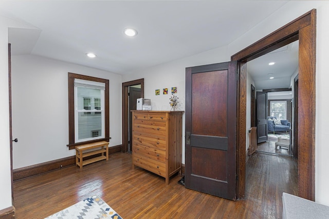 bedroom featuring baseboards, dark wood finished floors, and recessed lighting