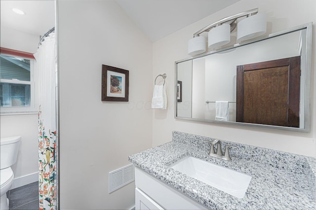 full bath featuring lofted ceiling, toilet, baseboards, visible vents, and vanity