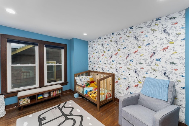 bedroom with recessed lighting, baseboards, and wood finished floors