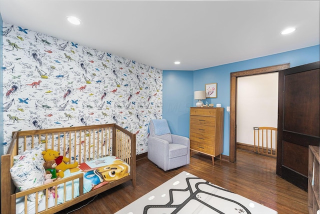 bedroom featuring recessed lighting, baseboards, wallpapered walls, and wood finished floors