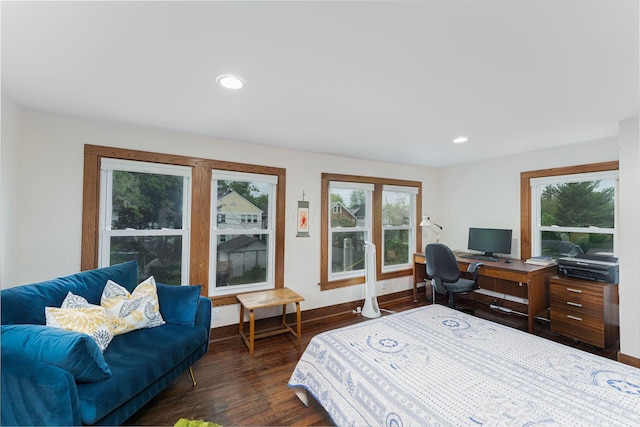 bedroom featuring dark wood finished floors, baseboards, recessed lighting, and multiple windows