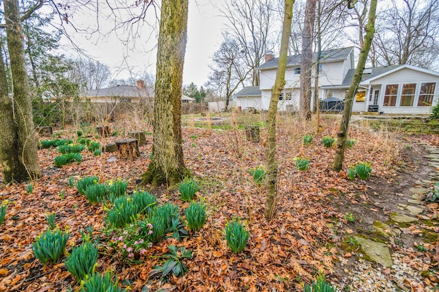 view of yard with a garden and fence