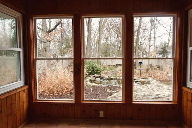 interior space featuring wood walls