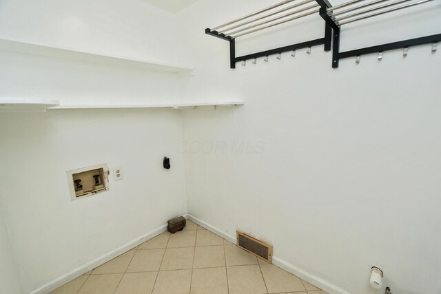laundry area with visible vents, washer hookup, light tile patterned flooring, gas dryer hookup, and laundry area