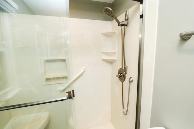 bathroom featuring a stall shower