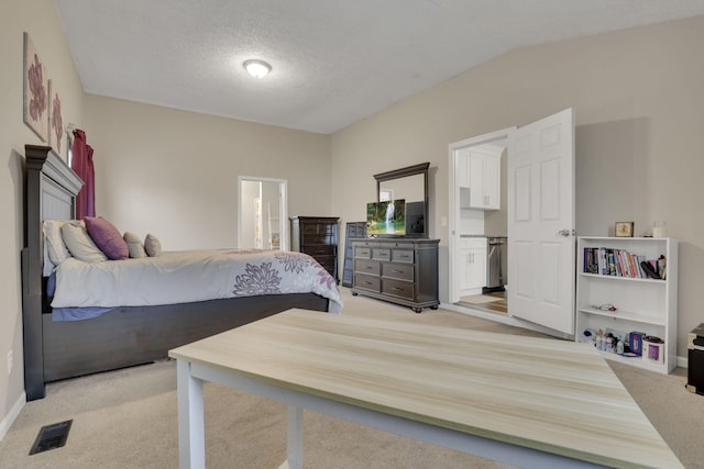 1333 Carolyn Ave, Columbus, OH 43224 - bedroom with visible vents, a textured ceiling, ensuite bath, light colored carpet, and lofted ceiling