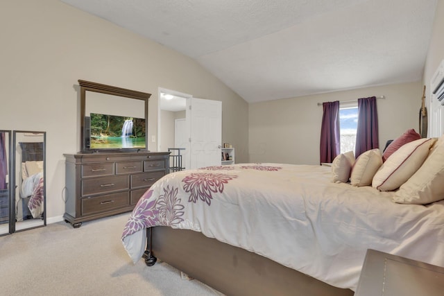 1333 Carolyn Ave, Columbus, OH 43224 - bedroom featuring a textured ceiling, light colored carpet, baseboards, and vaulted ceiling