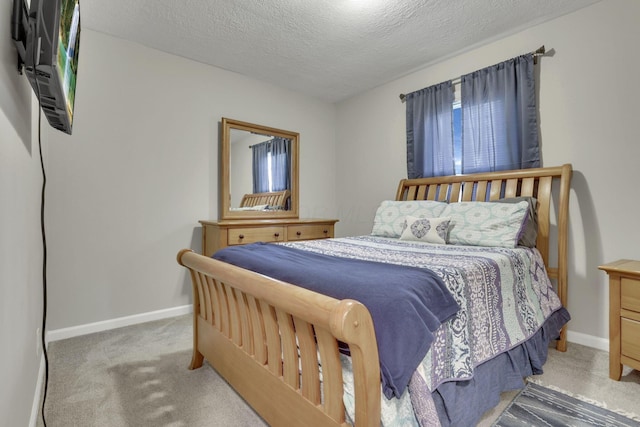1333 Carolyn Ave, Columbus, OH 43224 - carpeted bedroom with baseboards and a textured ceiling