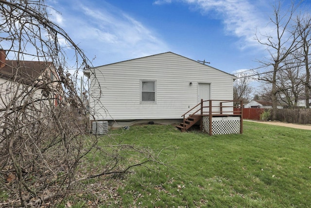 1333 Carolyn Ave, Columbus, OH 43224 - back of property featuring a yard, fence, and central AC