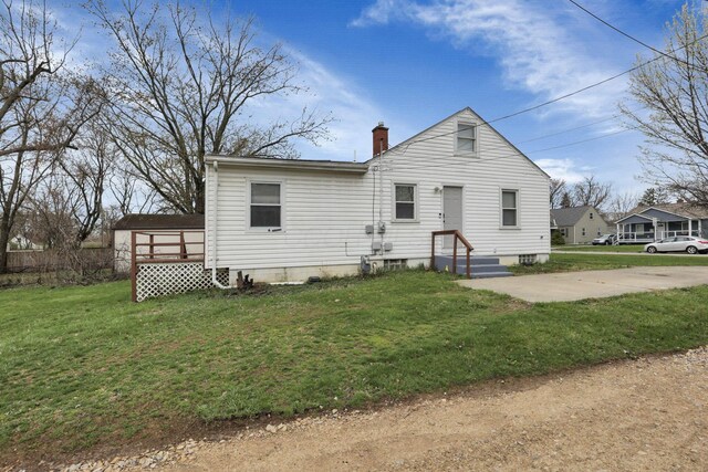 1333 Carolyn Ave, Columbus, OH 43224 - bungalow-style house with a front yard and a chimney