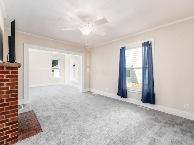 interior space featuring a wealth of natural light, a ceiling fan, and crown molding