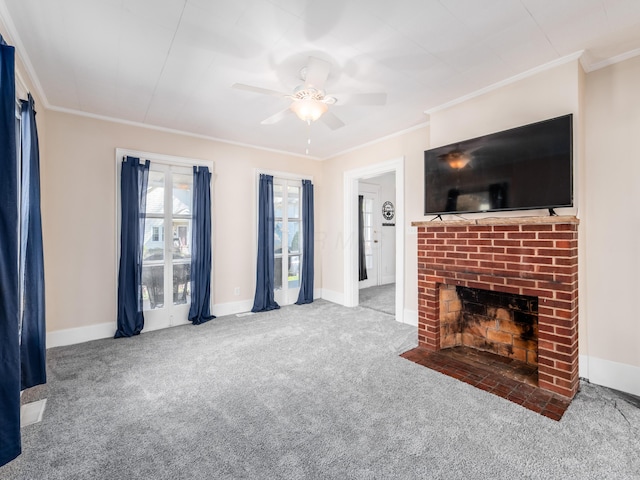 unfurnished living room featuring baseboards, ornamental molding, ceiling fan, and carpet