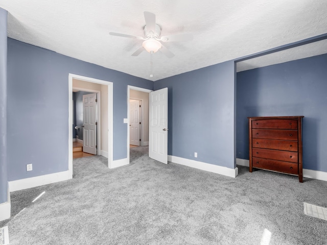 unfurnished bedroom featuring a ceiling fan, carpet flooring, and baseboards