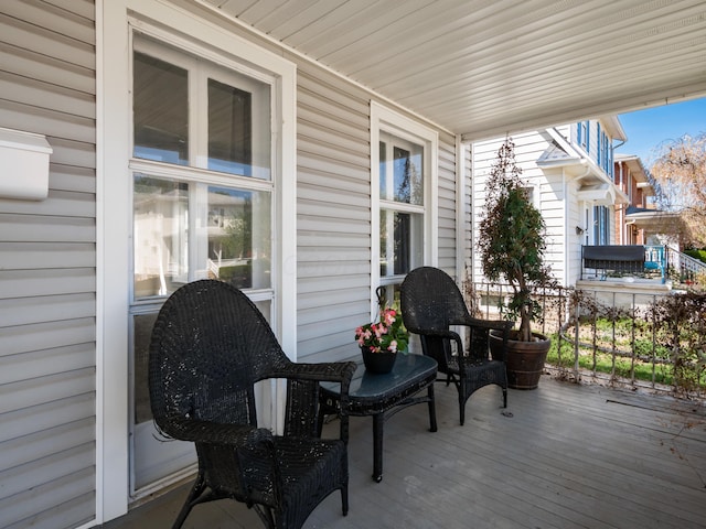 wooden terrace featuring a porch