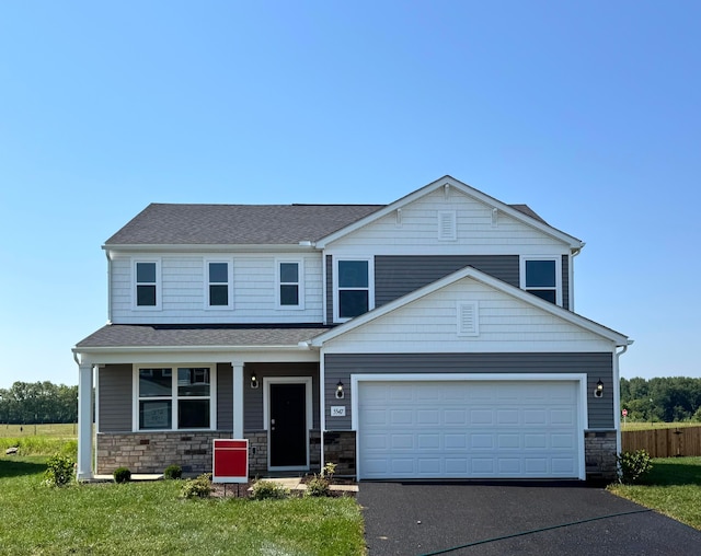 5547 Violet St Lot 372, South Bloomfield, OH 43103 - view of front of home with stone siding, asphalt driveway, a garage, a shingled roof, and a porch