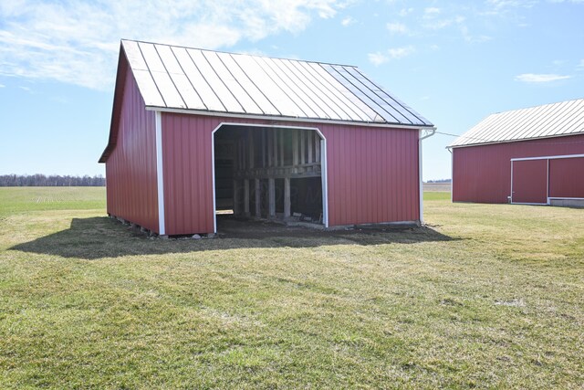 view of pole building with a lawn