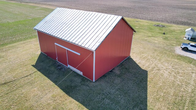 view of pole building with a lawn