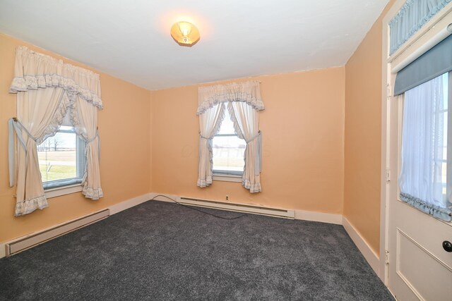 unfurnished room with carpet flooring, baseboards, baseboard heating, and a baseboard radiator