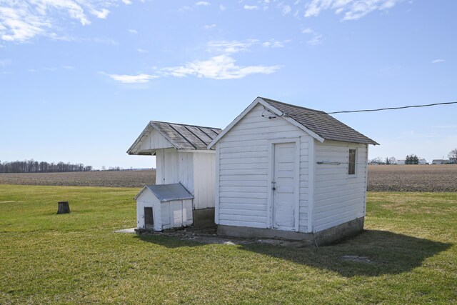 view of shed featuring a rural view