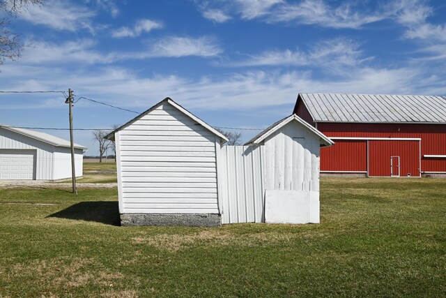 view of pole building with a yard