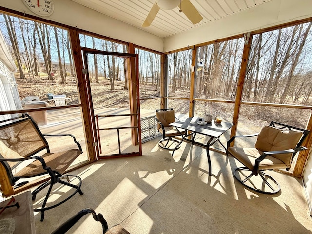 sunroom / solarium with ceiling fan and a wealth of natural light