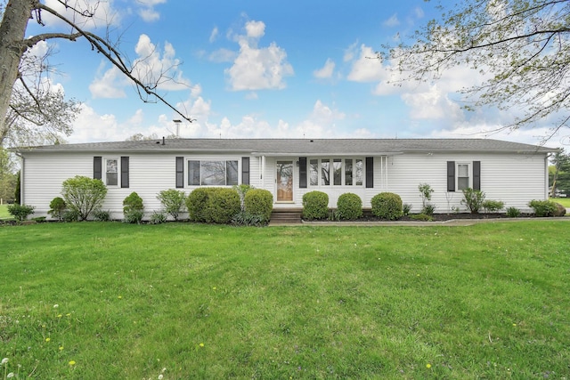 ranch-style house featuring a front lawn