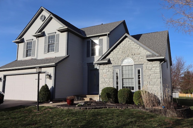 traditional home with stone siding, driveway, a garage, and roof with shingles