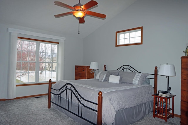 carpeted bedroom featuring visible vents, lofted ceiling, baseboards, and ceiling fan